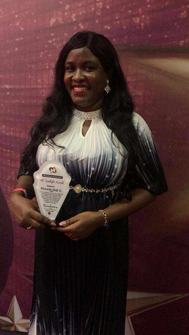 Smiling with award